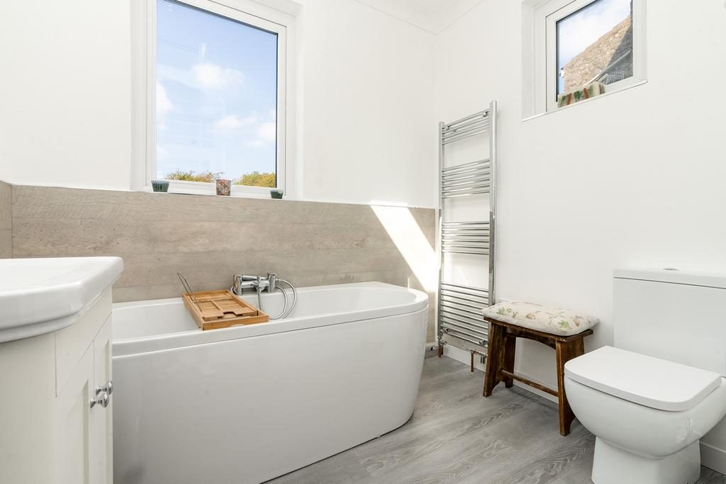 Family bathroom with a bath