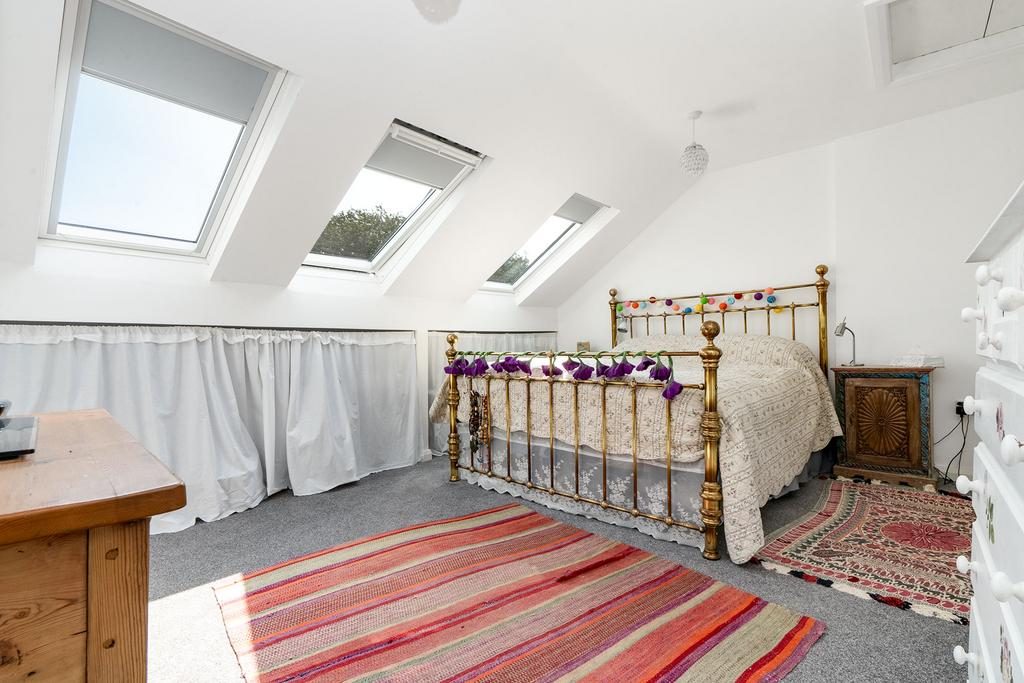 Bedroom on the top floor with skylights