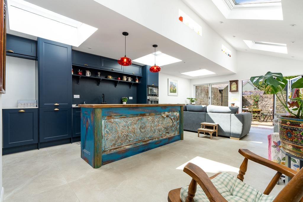 Kitchen with island, under skylights