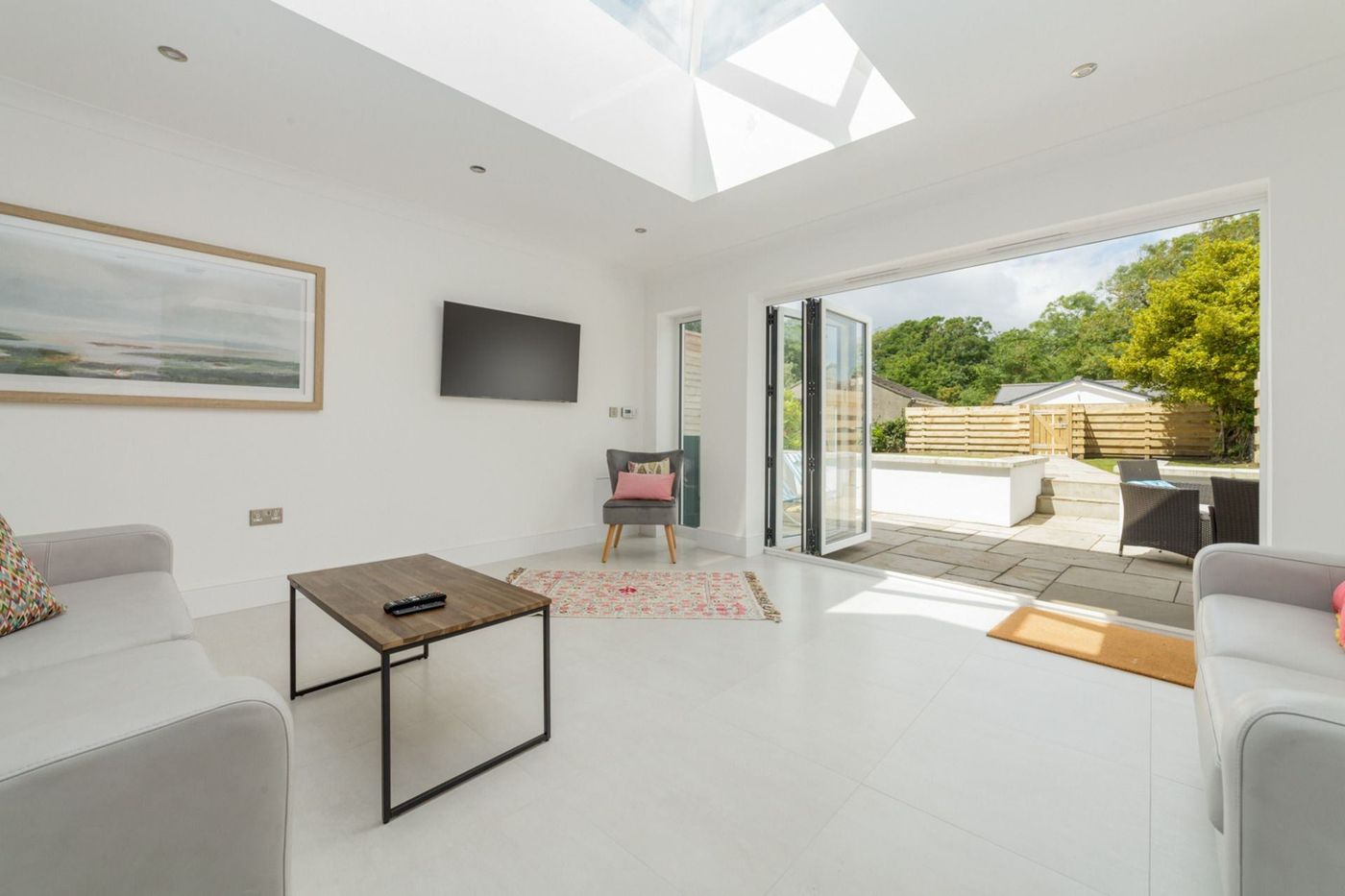 Open-plan living area with bi-fold doors onto the garden