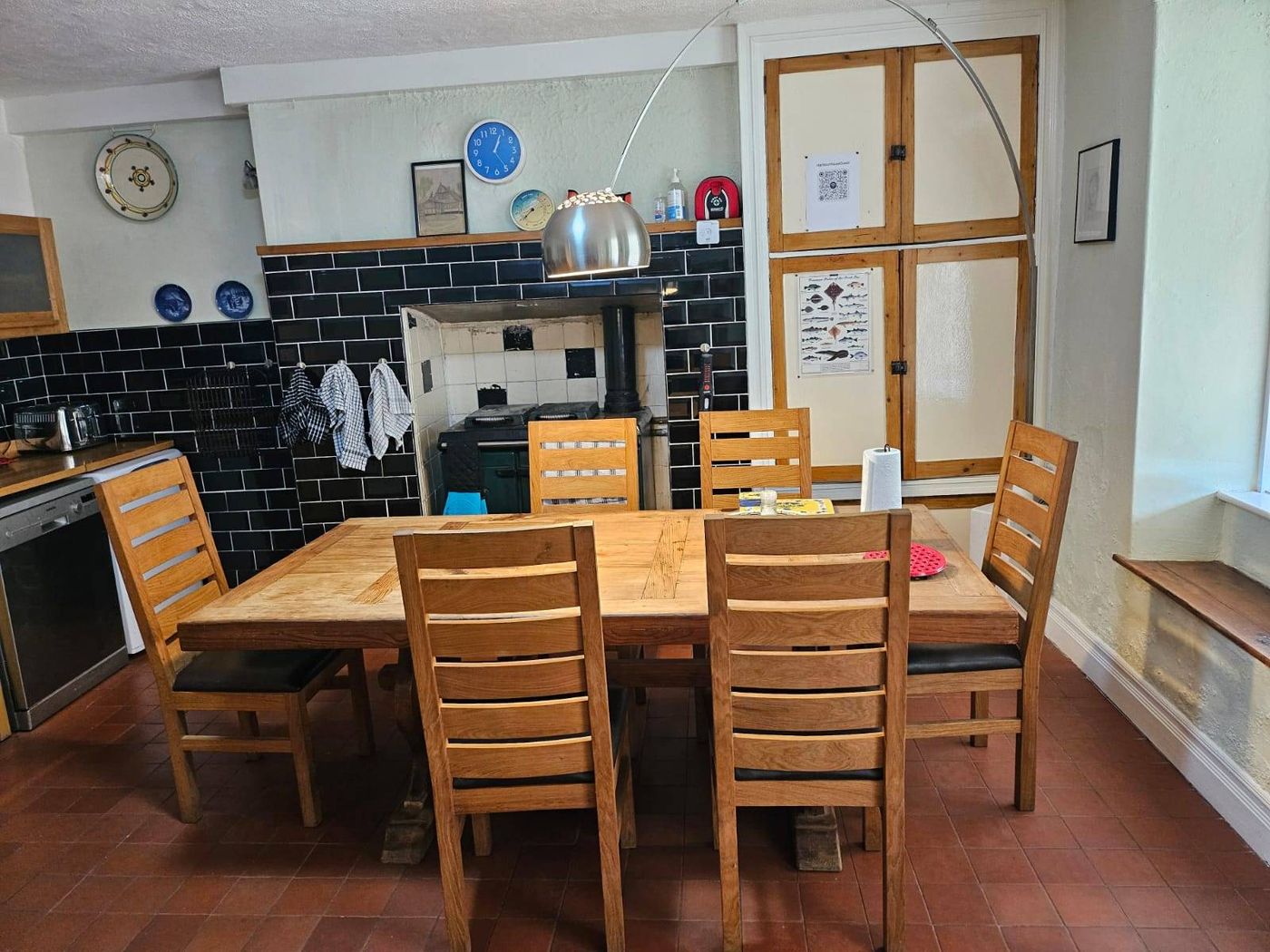 Farmhouse kitchen with a large dining table seating eight