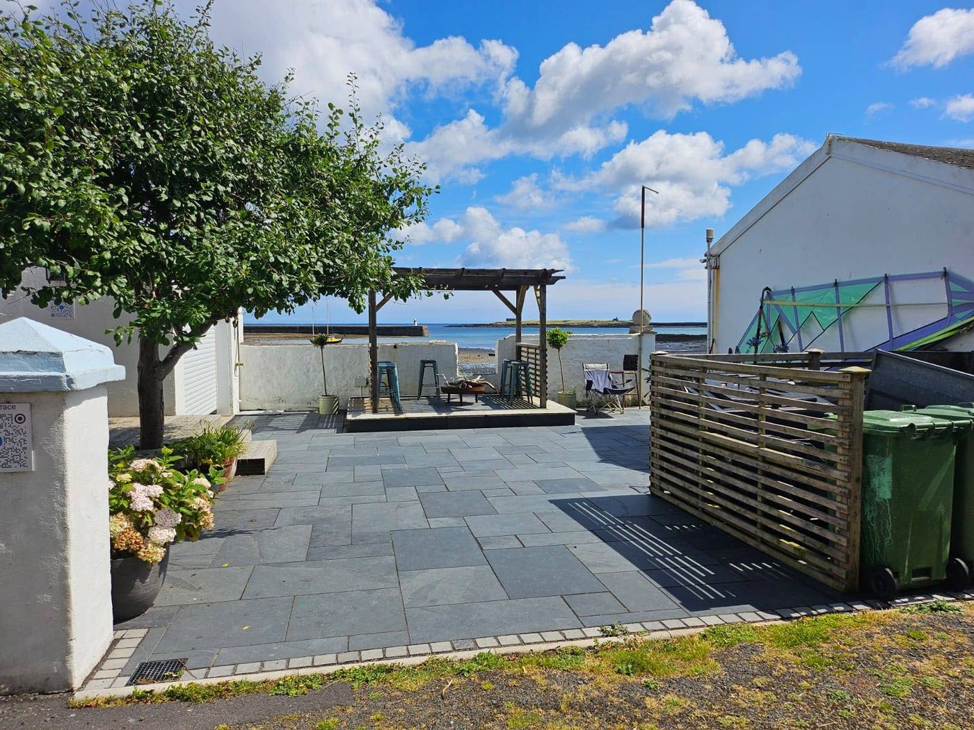 Beach-front patio at Harbour House, Derbyhaven, looking out to sea