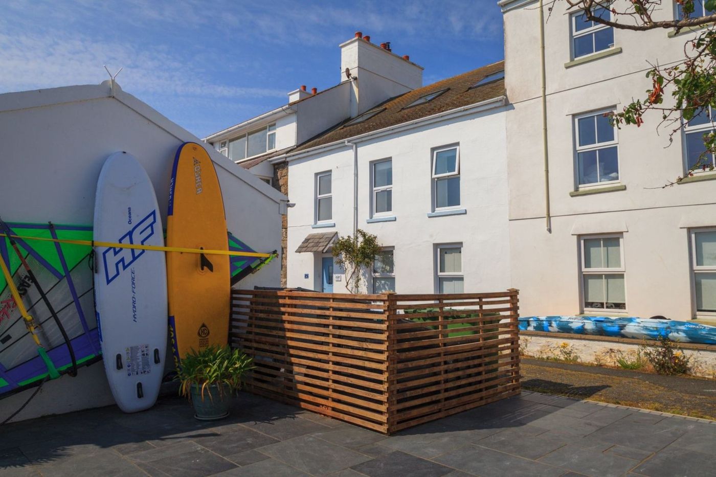 The Studio from the shore, with paddleboards outside