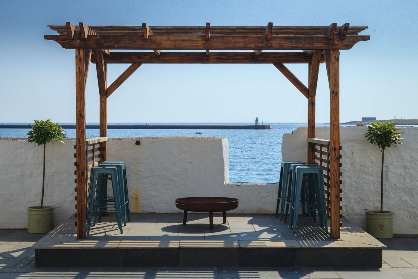 The pergola at The Studio, looking straight out over Derbyhaven bay